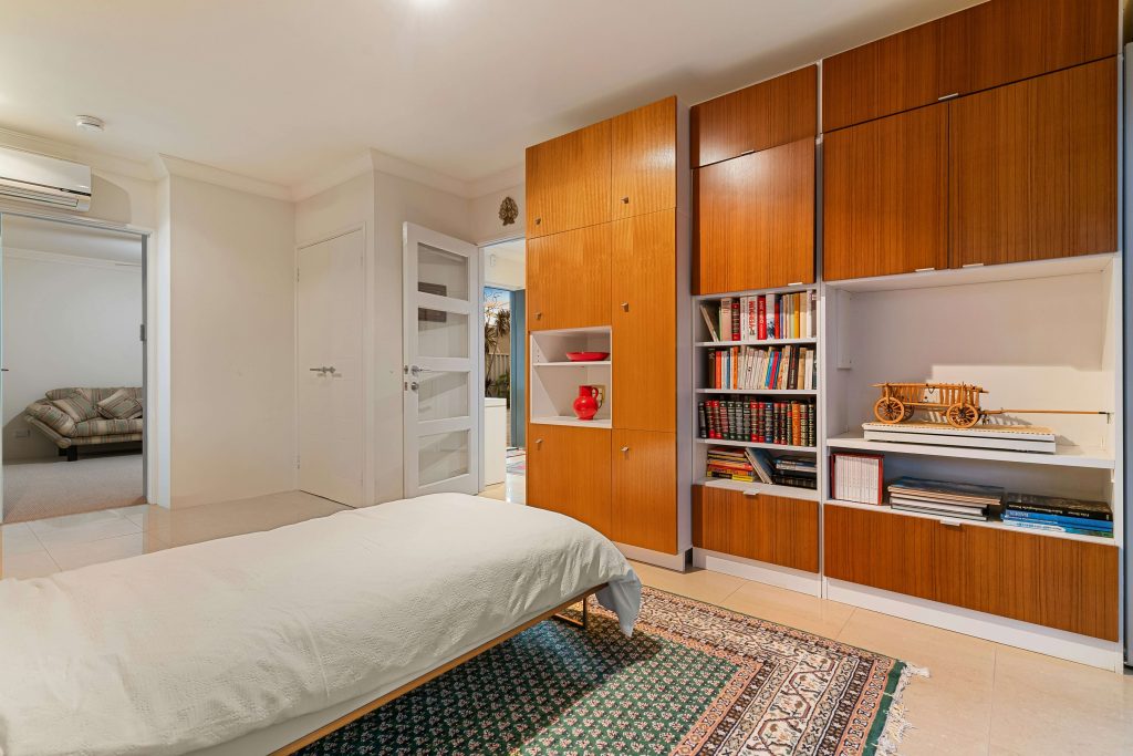 Murphy bed folded into wall in a studio apartment