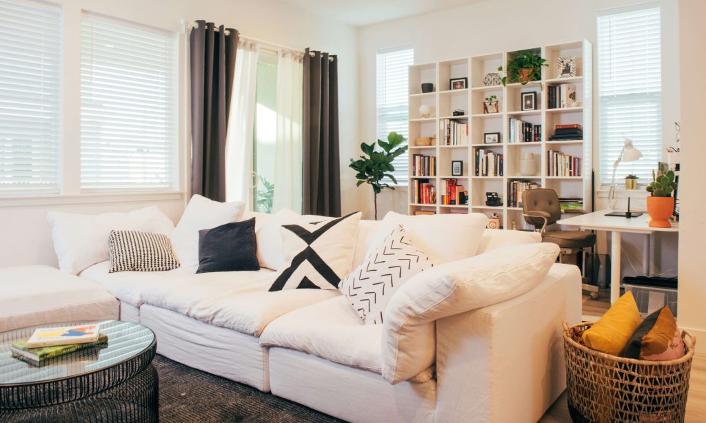 Storage ottoman used as coffee table and extra storage